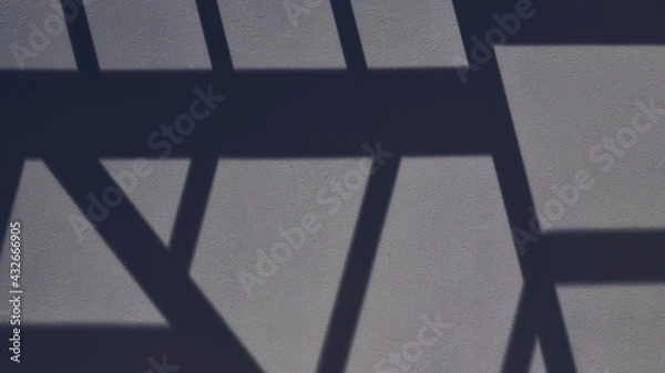 Obraz Geometric pattern on the wall formed by light and shadow