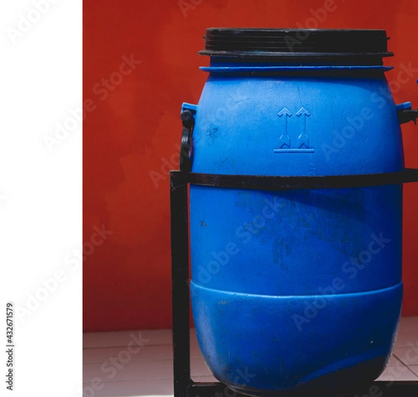 Fototapeta Blue trash can made from used buckets. Creativity like this is very good for the younger generation.