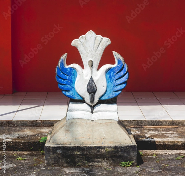 Fototapeta Wonogiri, Central Java, May 5, 2021, a symbol of Indonesia's state education, with the slogan Tut Wuri Handayani. It's near the flagpole.