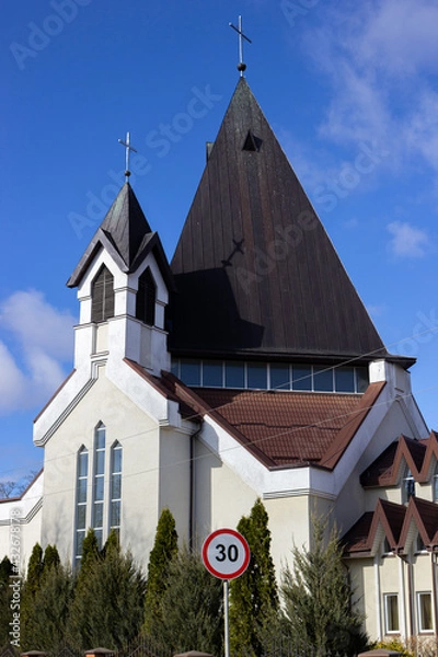 Fototapeta view of the building of the church with turrets
