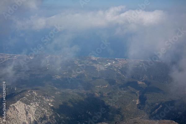 Fototapeta Mediterranean sea and cost view from the mountain summit through clouds