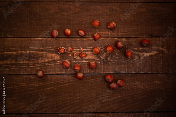 Obraz hazelnuts on the wooden background