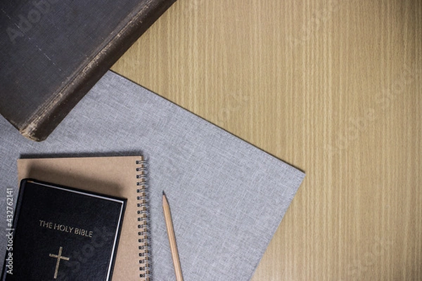 Obraz A holy bible with notebook on table.