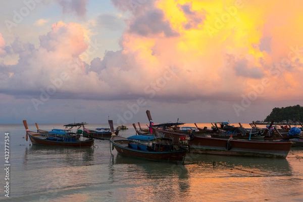 Fototapeta Longtail boats harbor at Ko Lipe island in evening light in Satun, Thailand.
