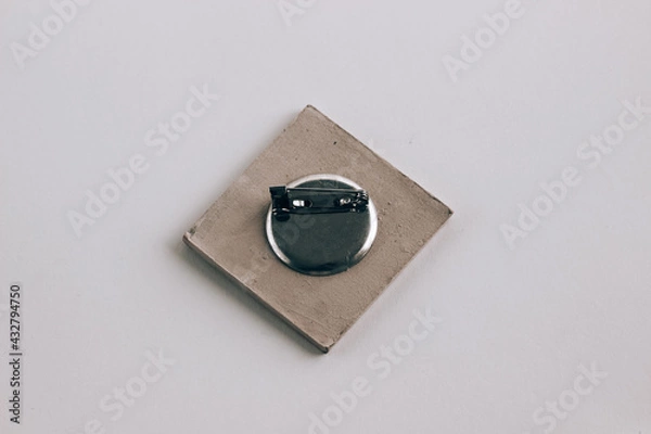 Obraz Closeup of jewelry lock mechanism, pin back closeup against white background, isolated square pin jewelry