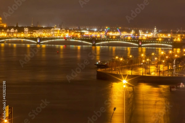 Fototapeta View of the embankment of the city of St. Petersburg at night with drawbridges