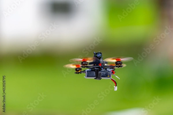 Obraz tiny race copter in action.