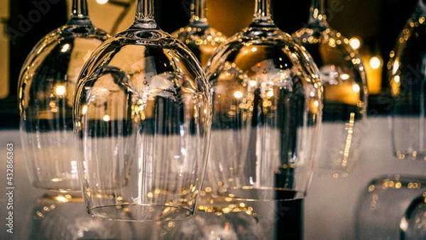 Fototapeta Wine glasses hung upside down.