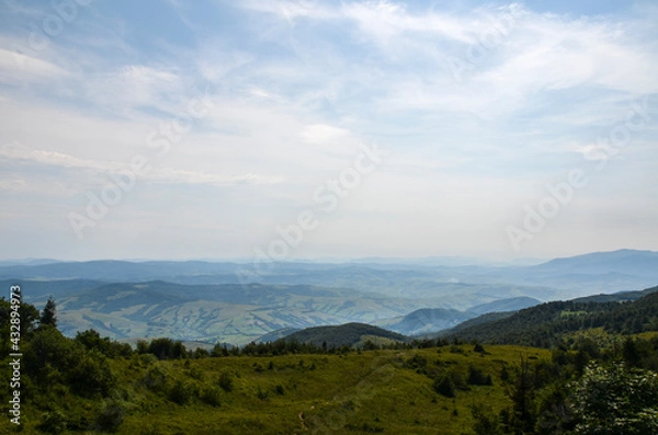 Fototapeta View from above of the hills mountains and fir trees home buildings in the village in summer season Carpathian mountains, Ukraine