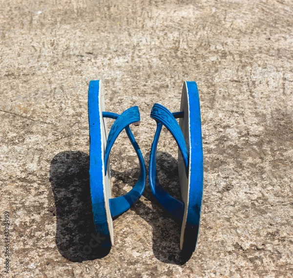 Fototapeta flip-flops in blue, white and black with a classic design. very good for products, business and creativity ideas.