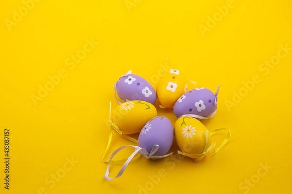 Fototapeta Colored easter eggs with patterns on on a yellow background