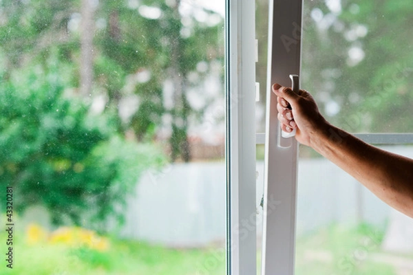 Obraz a man opens a window
