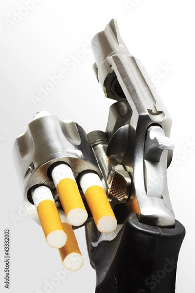 Fototapeta Revolver with cigarette bullets (clipping path)