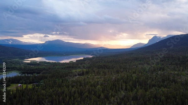 Fototapeta Drone view of the forests and mountains of Kvikkjokk, Swedish Lapland.