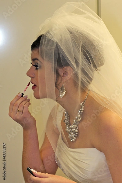 Fototapeta A bride posing for the camera
