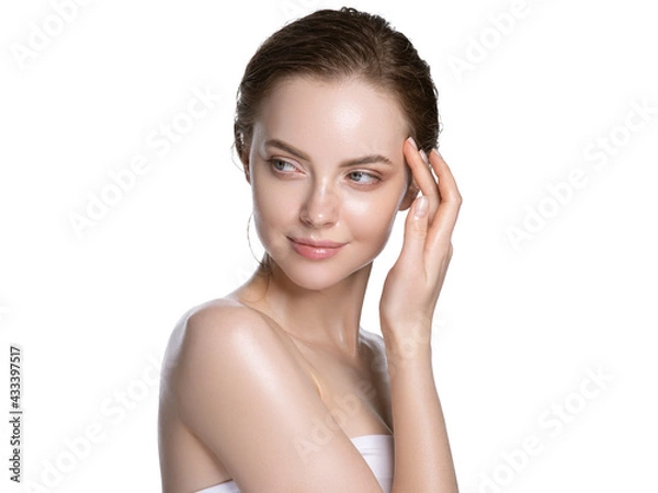 Fototapeta Beautiful young woman with healthy beauty skin carenatural clean fresh skin and beautiful hair isolated on white