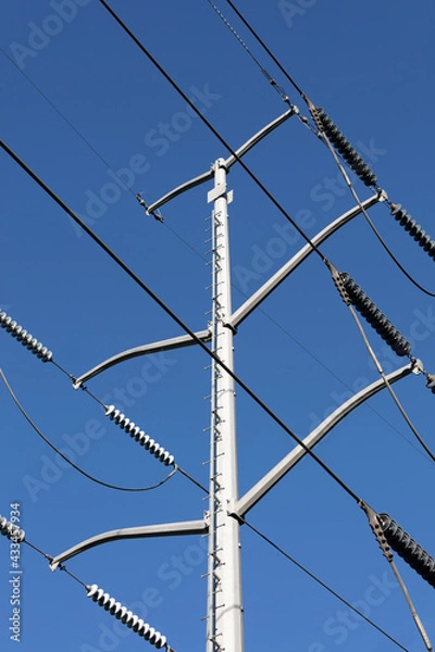 Fototapeta Electrical Power Lines tower against a blue sky