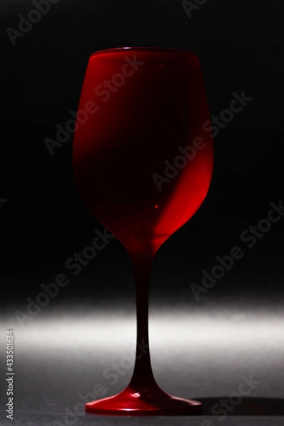 Fototapeta Red cup with black background
