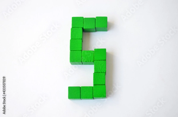 Fototapeta Number five from green cubes on a white background.
