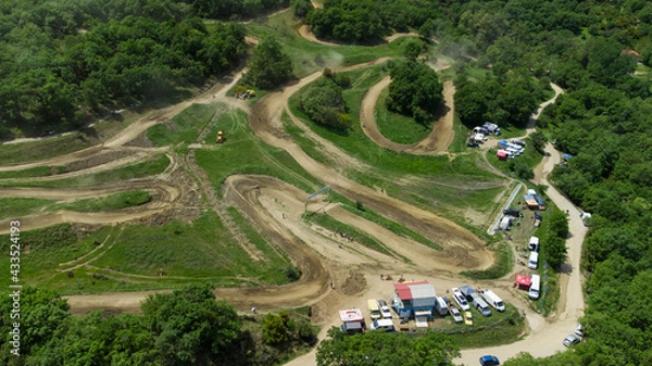 Fototapeta Aerial view of motocross track. Mx rider traing day.Drone view of mx track.