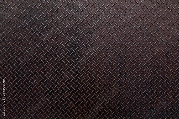 Obraz 赤黒く輝くチェッカープレートの鋼板