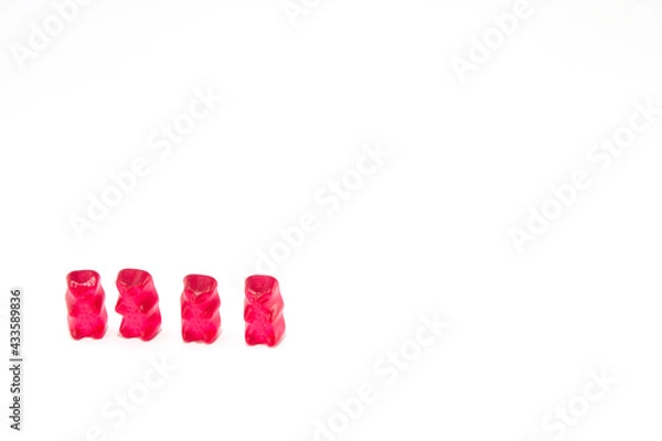 Obraz Group of four red gummy bears isolated on white background with copy space