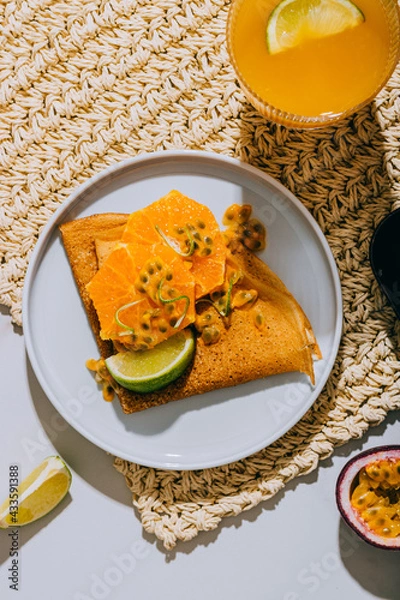 Fototapeta Crepes Or Thin Pancakes With Delicious passion fruit and lime.