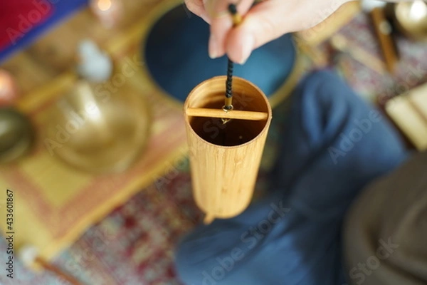 Obraz Hands of caucasian woman close up holding a koshi sound healing instrument