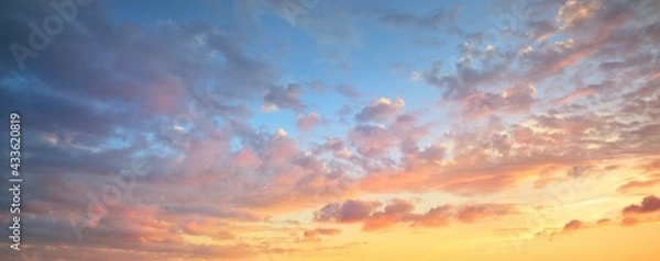 Obraz Clear blue sky. glowing pink and golden cirrus and cumulus clouds after storm, soft sunlight. Dramatic sunset cloudscape. Meteorology, heaven, peace, graphic resources, picturesque panoramic scenery
