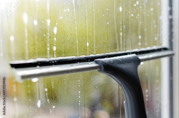 Obraz window cleaning with a window cleaning squeegee