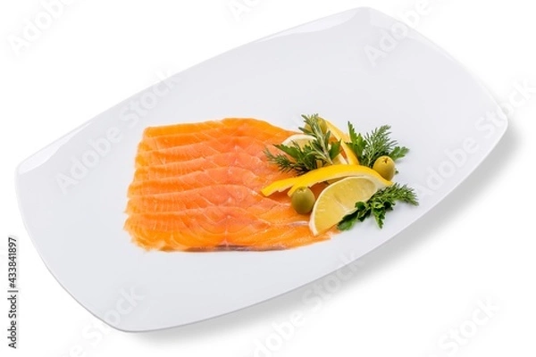 Fototapeta Sliced marinated red fish, garnished with lemon and olives. White background, white decor.