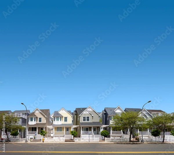 Fototapeta a row of suburban homes street and sidewalk spring-summer season