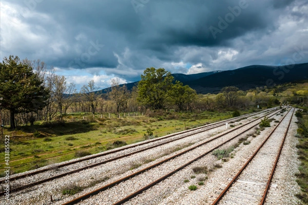 Obraz Ancient train tracks landscape. Horizontal aerial photography with drone. Concept of life, destiny or direction to follow, thought, reflection, meditation. Selective focus
