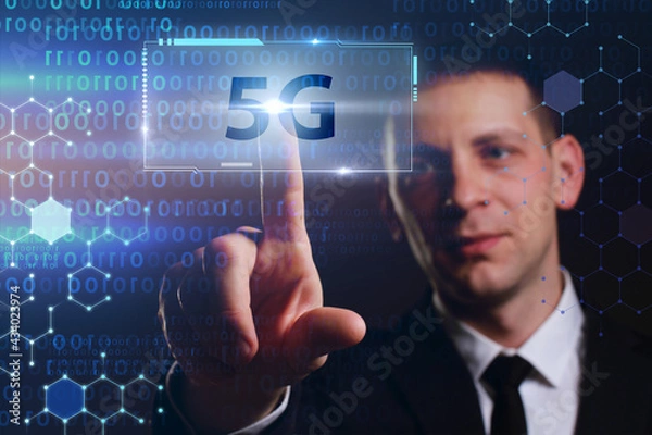 Fototapeta Business, Technology, Internet and network concept. Young businessman working on a virtual screen of the future and sees the inscription: 5G