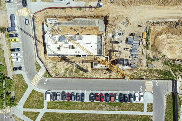 Fototapeta construction of foundation for new apartment building. aerial top view from flying drone