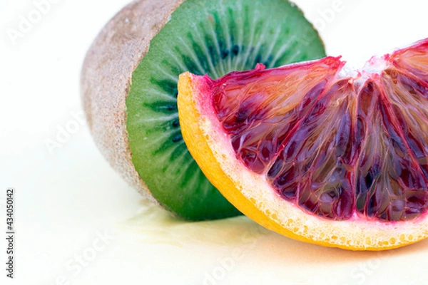 Fototapeta Grapefruit slice and cross cut kiwi isolated on white background. Part of set.