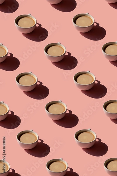 Fototapeta Cup of coffee pattern on pink background. Sunlight minimal trendy concept