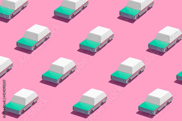 Obraz Minimal retro future car concept pattern wtih teal green cars on bright vibrant neon pink background. Trendy bold summer travel and road trip idea. Retro aesthetic.