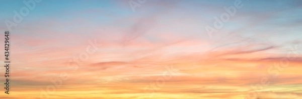 Obraz Clear blue sky. glowing pink and golden cirrus and cumulus clouds after storm, soft sunlight. Dramatic sunset cloudscape. Meteorology, heaven, peace, graphic resources, picturesque panoramic scenery