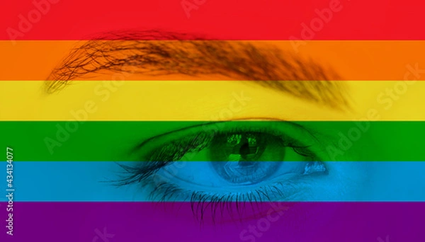Fototapeta Close up of eyes with LGBT Pride Rainbow flag isolated