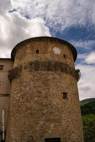 Fototapeta Closeup of an ancient medieval tower with clock, Tuscany, Italy.