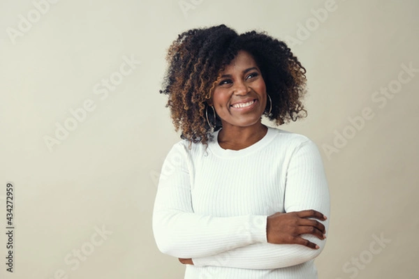 Obraz Looking up at copy space African American Smiling Woman Wearing a white sweater