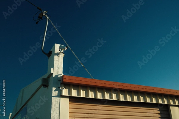 Fototapeta crane on a roof