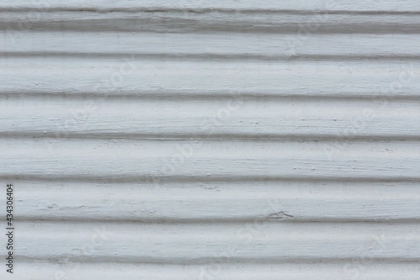 Fototapeta White painted concrete wall background. Wooden or stone or brick wall covered with plaster and painted with white paint.  Grey grungy  building wall texture with copy space.   