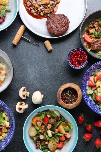 Fototapeta table full of food top view. Set of dishes on the table. meat salad and dessert on table top view