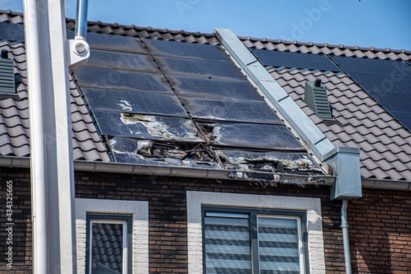 Obraz burned solar panels on roof