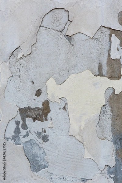 Fototapeta Old grey painted concrete wall background with peeling stucco.  Grunge wall texture with flaking plaster. Empty abstract distressed  paint and plasterwork backdrop. Aged cement masonry with copy space