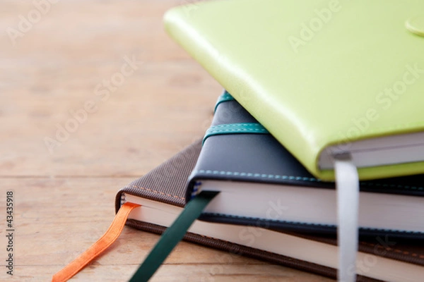 Obraz Notebook stack on wood table