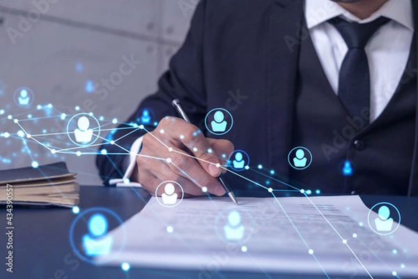 Fototapeta A potential employee in formal suit signing the contract to boost his career and gain new opportunities in personal growth. Concept of success. Hiring a new talented crew. Social media hologram icons