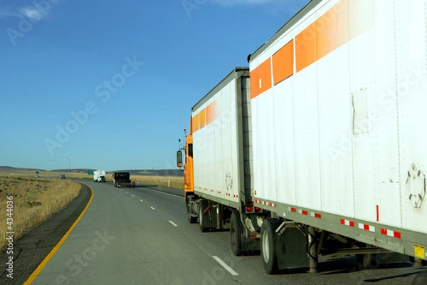 Fototapeta Semi truck going fast on interstate highway
